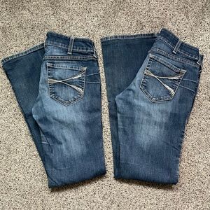 Two pairs of Ariat bootcut jeans both are size 29 regular length